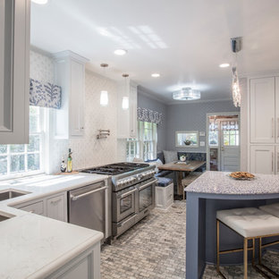 Photo of a mid-sized transitional single-wall eat-in kitchen in Oklahoma City with a double-bowl sink, recessed-panel cabinets, grey cabinets, recycled glass benchtops, multi-coloured splashback, mosaic tile splashback, stainless steel appliances, marble floors, with island, multi-coloured floor and white benchtop.