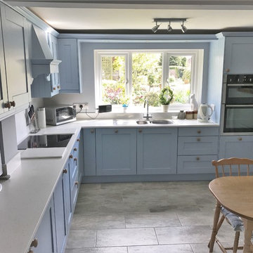Crown Imperial Midsomer Kitchen in Mid Blue with Minerva Ice Crystal worktops