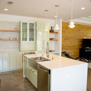 Design ideas for a medium sized contemporary l-shaped open plan kitchen in Miami with flat-panel cabinets, green cabinets, multi-coloured splashback, mosaic tiled splashback, stainless steel appliances, an island, a belfast sink and quartz worktops.
