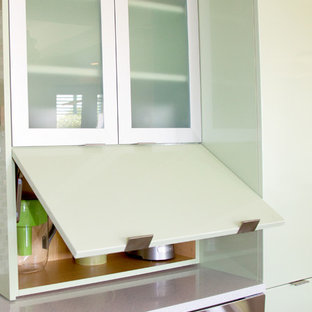Design ideas for a medium sized contemporary l-shaped open plan kitchen in Miami with flat-panel cabinets, green cabinets, multi-coloured splashback, mosaic tiled splashback, stainless steel appliances, an island and quartz worktops.