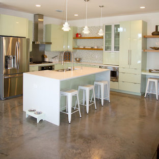 Inspiration for a medium sized contemporary l-shaped open plan kitchen in Miami with flat-panel cabinets, green cabinets, multi-coloured splashback, mosaic tiled splashback, stainless steel appliances, an island, a belfast sink and quartz worktops.