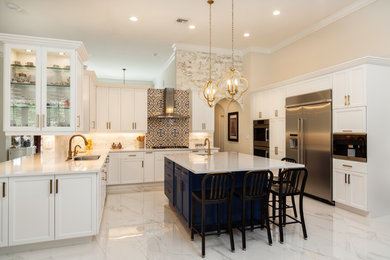 Inspiration for a large transitional u-shaped porcelain tile and white floor open concept kitchen remodel in Miami with an undermount sink, recessed-panel cabinets, white cabinets, quartz countertops, white backsplash, porcelain backsplash, stainless steel appliances, an island and white countertops