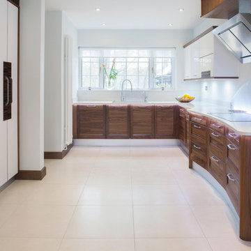 Curved wooden kitchen featuring accent lighting