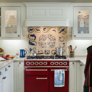 Inspiration for a small classic u-shaped kitchen in Cornwall with quartz worktops, ceramic splashback, coloured appliances, beige worktops, raised-panel cabinets, white cabinets, multi-coloured splashback and no island.