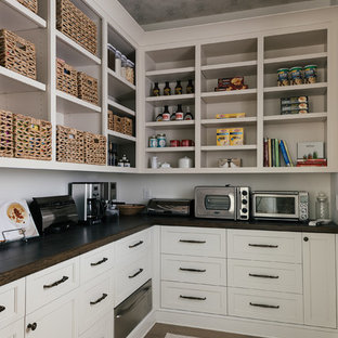 Large transitional kitchen pantry ideas - Example of a large transitional l-shaped light wood floor and brown floor kitchen pantry design in Atlanta with shaker cabinets, white cabinets, wood countertops, white backsplash, stainless steel appliances and no island