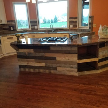 Custom Barnwood backsplash, kitchen accents, door and lighiting