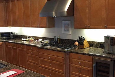 Custom Brown Cabinetry with Granite Installation