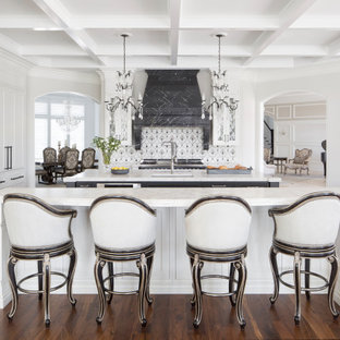 Inspiration for a separate kitchen in St Louis with an undermount sink, shaker cabinets, white cabinets, multi-coloured splashback, medium hardwood floors, multiple islands, white benchtop and coffered.