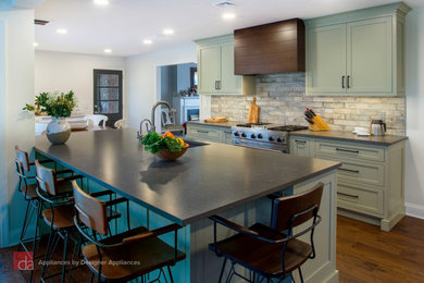 Mid-sized transitional galley medium tone wood floor and brown floor eat-in kitchen photo in Newark with an undermount sink, beaded inset cabinets, green cabinets, quartz countertops, multicolored backsplash, an island and gray countertops
