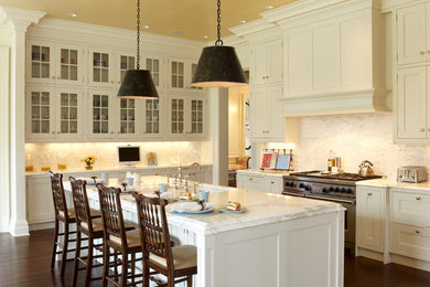 Kitchen - traditional kitchen idea in New York with a single-bowl sink, recessed-panel cabinets, white cabinets, white backsplash and stainless steel appliances