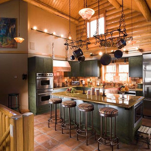 Inspiration for a traditional l-shaped kitchen in Other with shaker cabinets, green cabinets, brown splashback, mosaic tile splashback and stainless steel appliances.