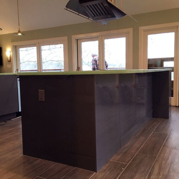 Custom glass countertops and Italian lacquered cabinets.