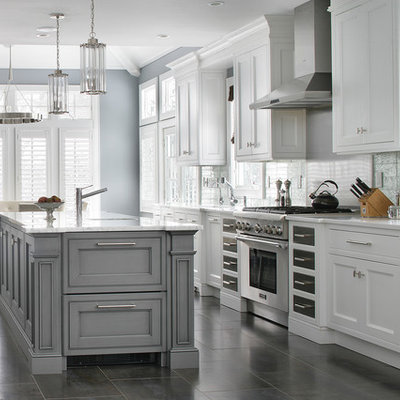 Eat-in kitchen - transitional galley eat-in kitchen idea in New York with beaded inset cabinets, white cabinets, stainless steel appliances, an island, gray backsplash and white countertops