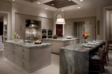 Huge trendy eat-in kitchen photo in Orlando with a single-bowl sink, flat-panel cabinets, gray cabinets, marble countertops and paneled appliances