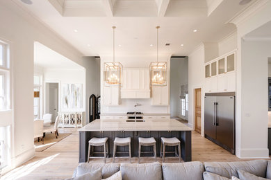 Example of a large transitional single-wall light wood floor eat-in kitchen design in New Orleans with a drop-in sink, shaker cabinets, gray cabinets, quartzite countertops, white backsplash, subway tile backsplash, stainless steel appliances and an island