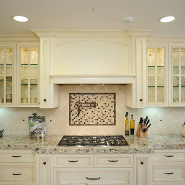 Custom hood and glass-front cabinets
