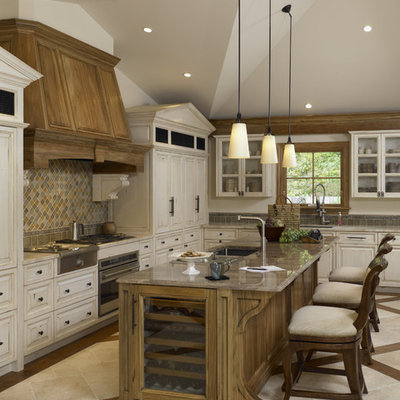 Inspiration for a timeless kitchen remodel in Chicago with glass-front cabinets and paneled appliances