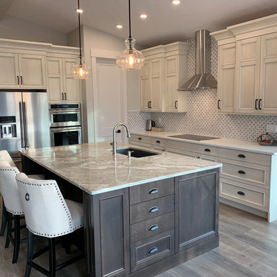 Inspiration for a large timeless l-shaped laminate floor and gray floor eat-in kitchen remodel in Calgary with an undermount sink, recessed-panel cabinets, distressed cabinets, quartz countertops, white backsplash, marble backsplash, stainless steel appliances, an island and white countertops