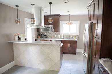 Example of a classic galley eat-in kitchen design in Cincinnati with an island