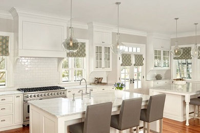 Inspiration for a huge transitional single-wall dark wood floor eat-in kitchen remodel in Charleston with an undermount sink, shaker cabinets, white cabinets, marble countertops, multicolored backsplash, stainless steel appliances, an island and glass tile backsplash