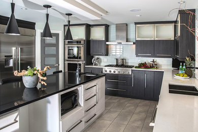 Example of a large trendy ceramic tile kitchen design in Other with dark wood cabinets, stainless steel appliances, an island, an undermount sink, flat-panel cabinets and quartz countertops