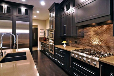 Example of a mid-sized transitional single-wall dark wood floor kitchen design in Chicago with shaker cabinets, dark wood cabinets, an island, a double-bowl sink, limestone countertops, brown backsplash, mosaic tile backsplash and stainless steel appliances