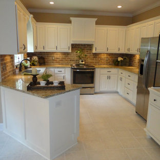 Mid-sized traditional enclosed kitchen pictures - Mid-sized elegant u-shaped linoleum floor and beige floor enclosed kitchen photo in Atlanta with an undermount sink, recessed-panel cabinets, white cabinets, granite countertops, brown backsplash, brick backsplash, stainless steel appliances, no island and multicolored countertops