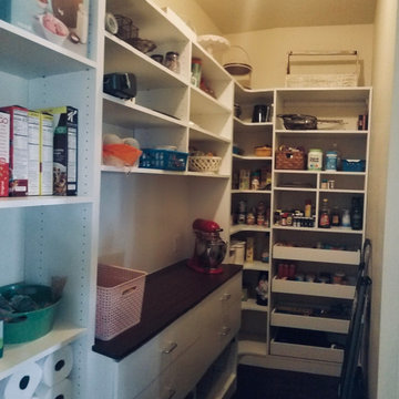 Custom pantry with corner shelves and countertop