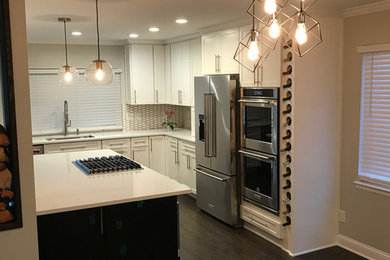 Inspiration for a small transitional l-shaped dark wood floor and brown floor open concept kitchen remodel in Birmingham with shaker cabinets, white cabinets, white backsplash, stainless steel appliances, an island and white countertops