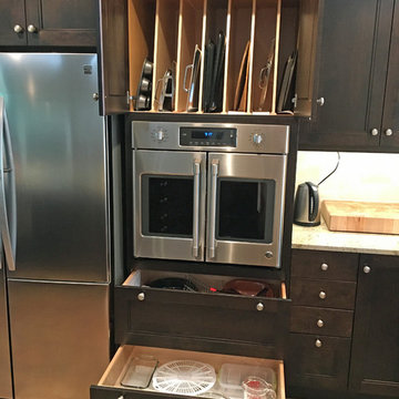 Custom tall oven cabinet with vertical tray storage, a French Door convection ov