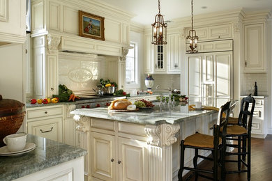 Example of a trendy u-shaped medium tone wood floor eat-in kitchen design in New York with an undermount sink, beaded inset cabinets, beige cabinets, granite countertops, white backsplash, ceramic backsplash and an island