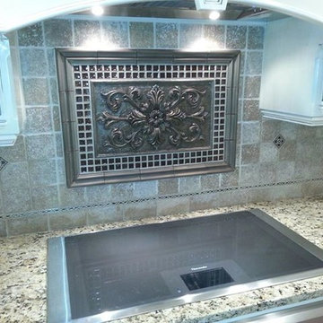 Custom tile back with decorative metal insert