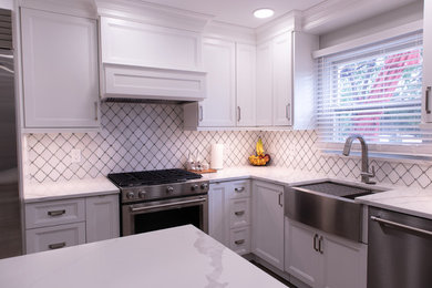 Eat-in kitchen - mid-sized transitional l-shaped eat-in kitchen idea in New York with beaded inset cabinets, white cabinets, quartzite countertops, white backsplash, stainless steel appliances, an island and white countertops