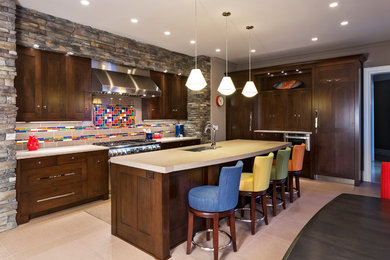 Example of a large trendy porcelain tile eat-in kitchen design in Charlotte with an undermount sink, flat-panel cabinets, dark wood cabinets, quartz countertops, multicolored backsplash, ceramic backsplash, stainless steel appliances and an island