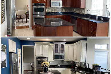 Example of a classic l-shaped eat-in kitchen design with raised-panel cabinets, white cabinets, gray backsplash, subway tile backsplash and an island