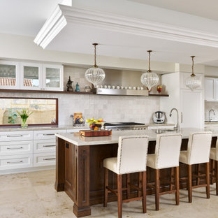 Design ideas for a traditional galley kitchen in Perth with an undermount sink, recessed-panel cabinets, white cabinets, white splashback, stainless steel appliances, with island, beige floor and beige benchtop.