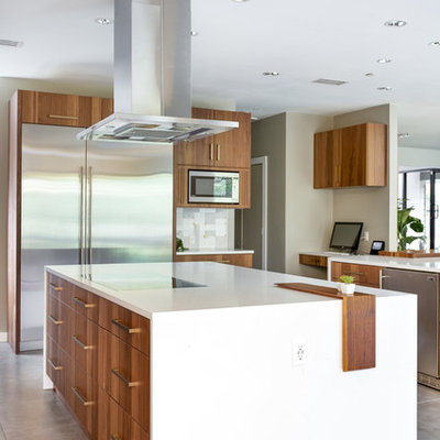 Eat-in kitchen - huge modern u-shaped porcelain tile and gray floor eat-in kitchen idea in Dallas with a single-bowl sink, flat-panel cabinets, medium tone wood cabinets, quartz countertops, gray backsplash, marble backsplash, stainless steel appliances, two islands and white countertops