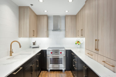 Eat-in kitchen - small contemporary medium tone wood floor and brown floor eat-in kitchen idea in Dallas with an undermount sink, flat-panel cabinets, light wood cabinets, quartz countertops, white backsplash, ceramic backsplash, stainless steel appliances and white countertops