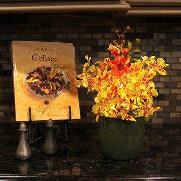 Dancing Orchids - Orange in Green Ceramic Vase
