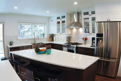 Eat-in kitchen - mid-sized craftsman l-shaped dark wood floor and brown floor eat-in kitchen idea in Other with a farmhouse sink, shaker cabinets, dark wood cabinets, marble countertops, white backsplash, marble backsplash, stainless steel appliances and an island