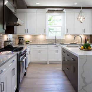 Large transitional open concept kitchen photos - Example of a large transitional u-shaped light wood floor and brown floor open concept kitchen design in San Francisco with an undermount sink, shaker cabinets, dark wood cabinets, quartz countertops, gray backsplash, ceramic backsplash, stainless steel appliances and an island