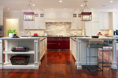 Example of a classic kitchen design in New York with colored appliances and two islands