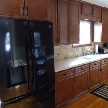 Dark Cabinets with White Counters