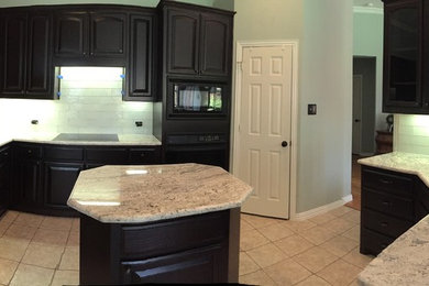 Photo of a medium sized traditional kitchen/diner in Dallas with white splashback and stainless steel appliances.