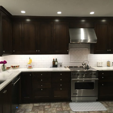 Dark Dramatic Kitchen with Shaker Style Cabinets & White Subway Tile