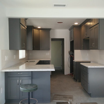 Dark grey shaker kitchen cabinets with Silestone Quartz slabs countertops