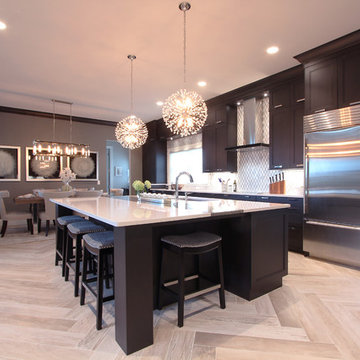 Dark Stained Cabinets in Kitchen with Herringbone Wood Floors