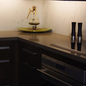 Dark wood modern kitchen with stainless steel Wolf appliances