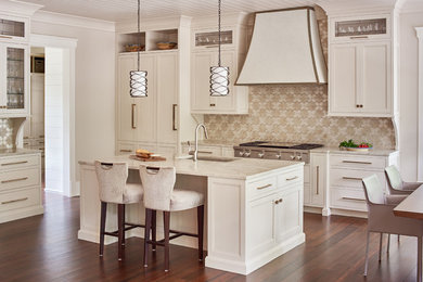 Large transitional medium tone wood floor and brown floor eat-in kitchen photo in Charlotte with a single-bowl sink, beige cabinets, quartzite countertops, beige backsplash, stainless steel appliances, an island and beaded inset cabinets