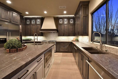 Example of a trendy kitchen design in Phoenix with quartzite countertops